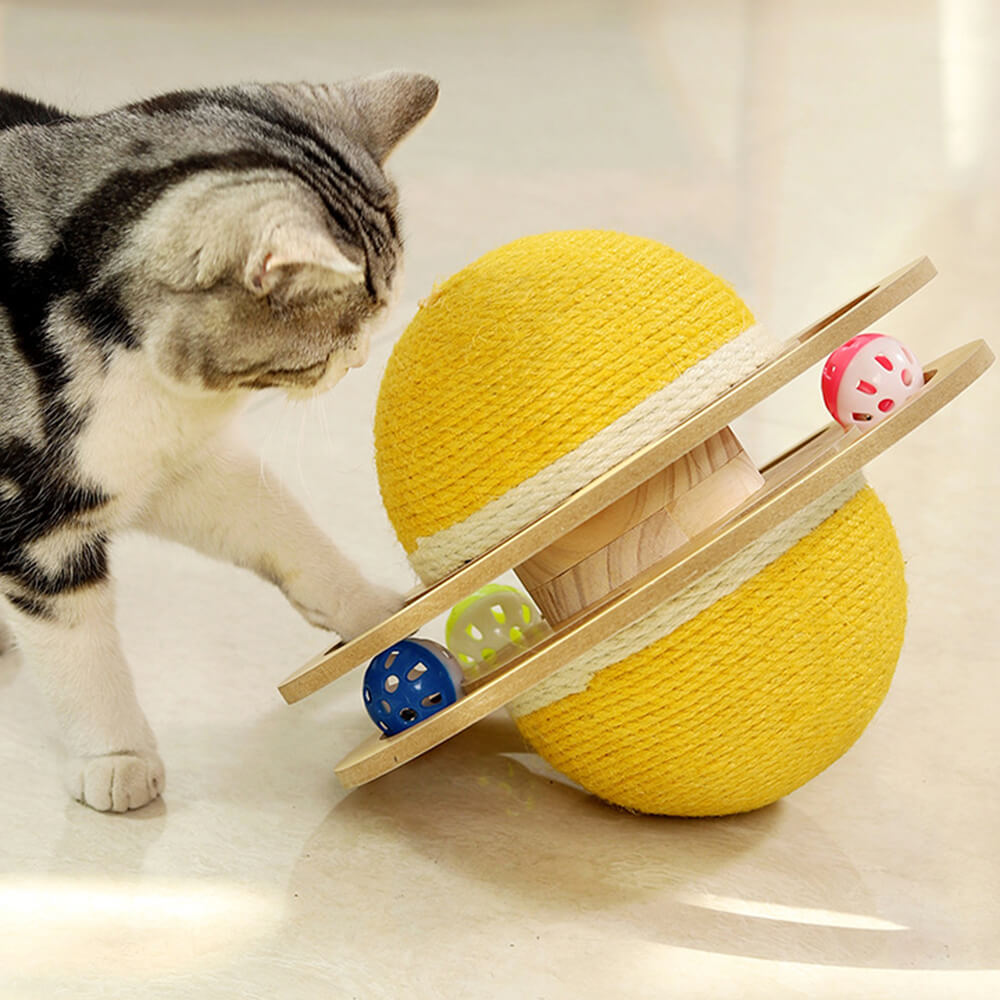 Cat playing with sisal scratching ball showing its spherical shape and colorful inside