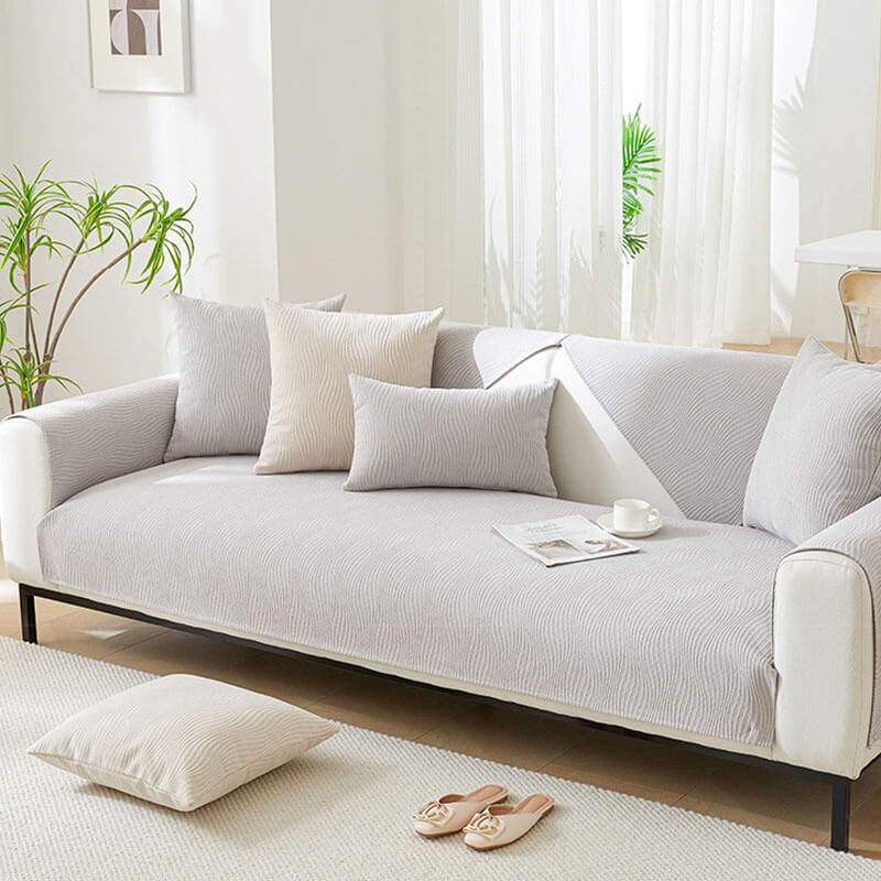 Wood grain textured chenille sofa cover protecting a modern sofa
