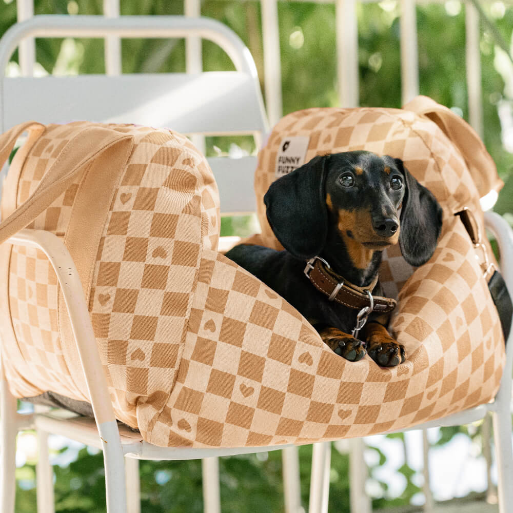 Close-up of the vintage checkerboard dog car seat with safety harness for small dogs