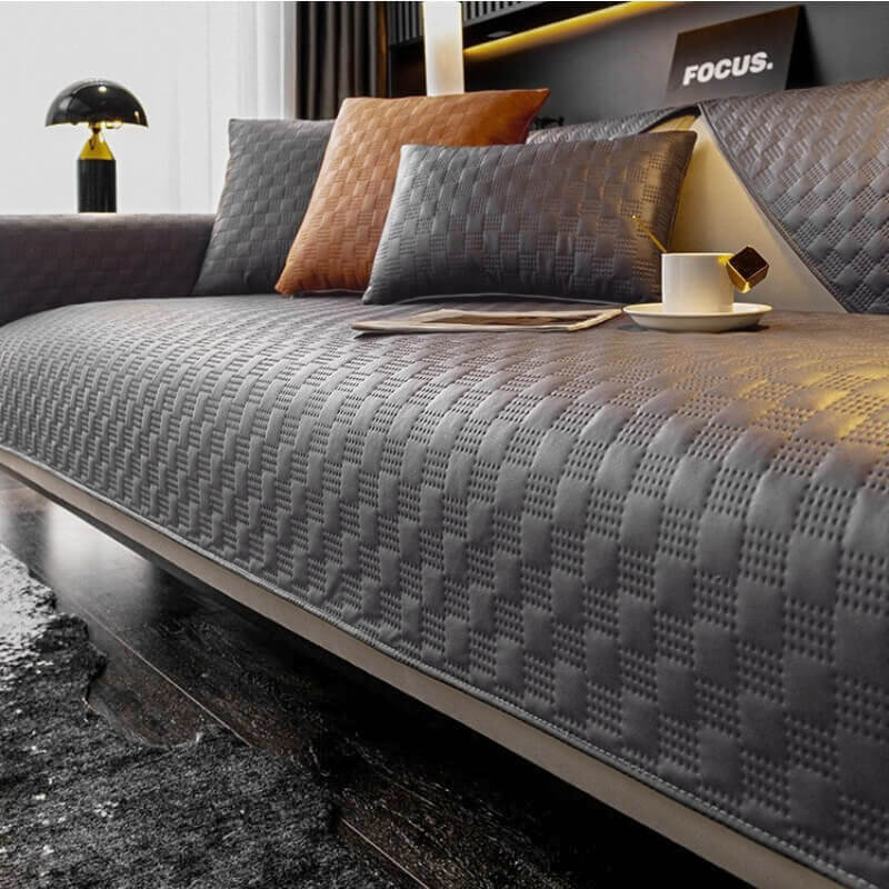 Close-up of the premium waterproof faux leather sofa cover showcasing texture and design.