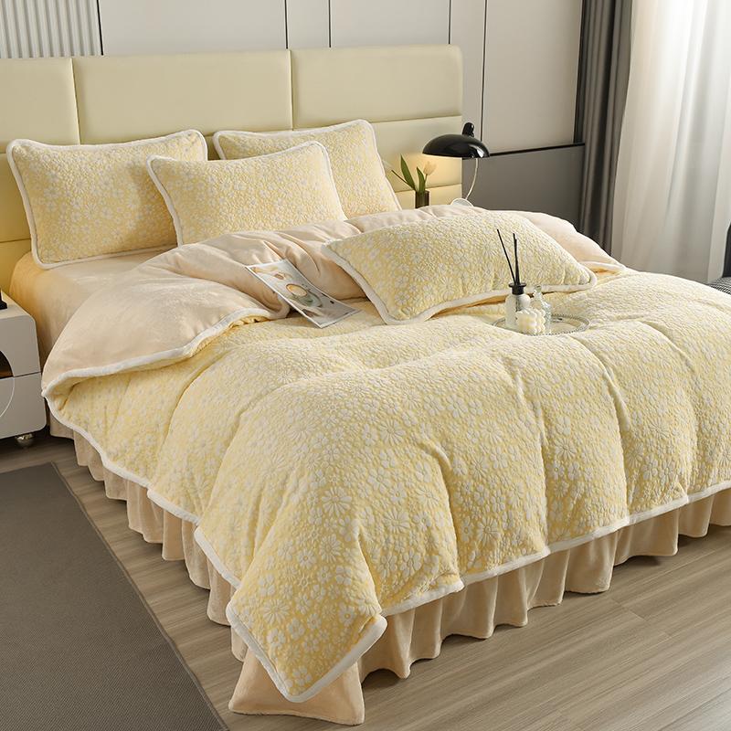 Elegant carved velvet floral bedding set on a luxurious bed with plush pillows