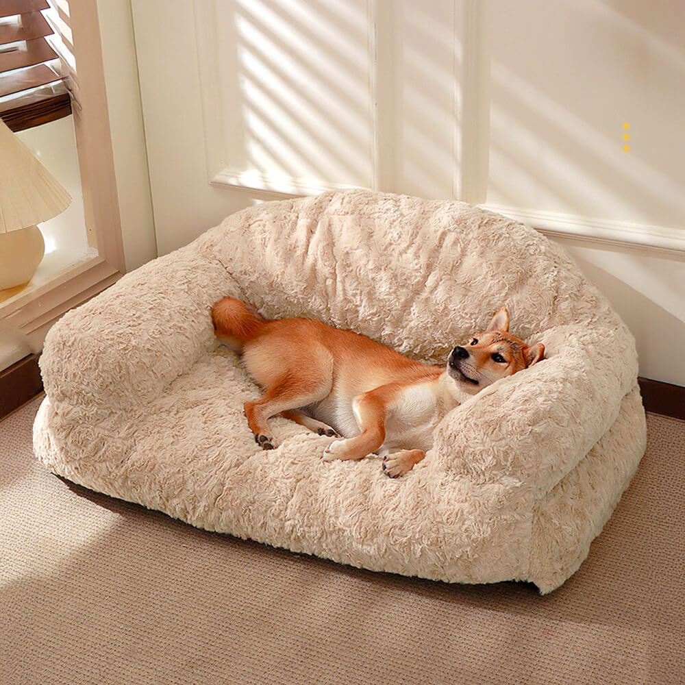 Front angle of the SnuggleNest pet sofa with bolstered sides on hardwood floor