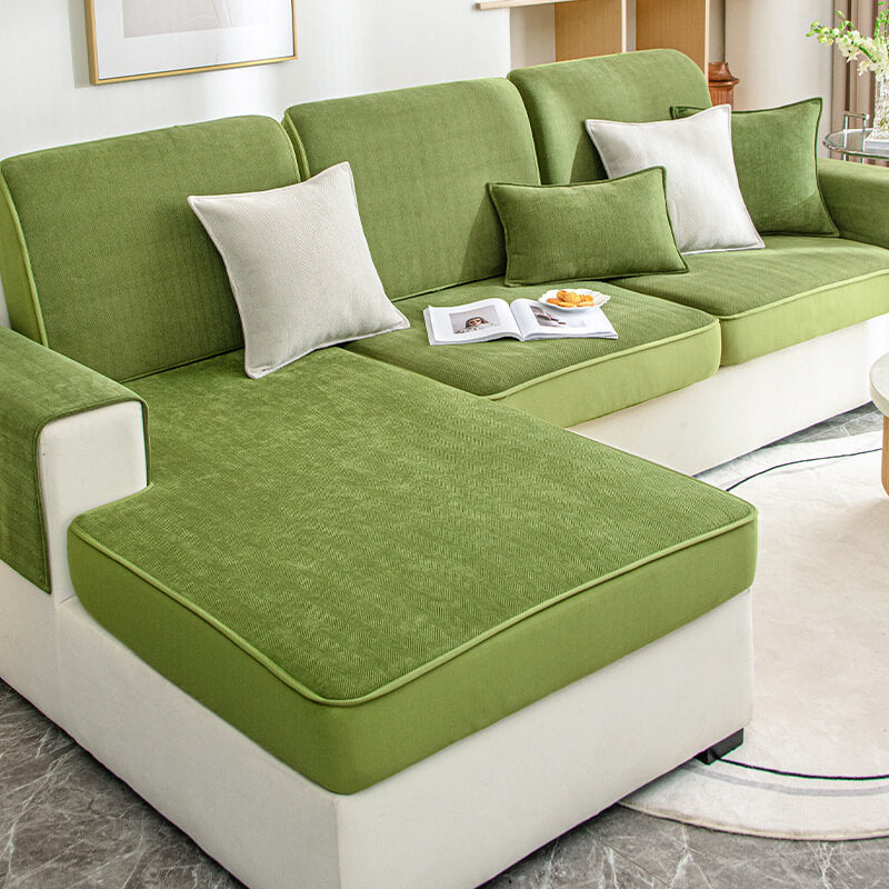 Close-up of elastic fit on chenille sofa cover showing herringbone pattern