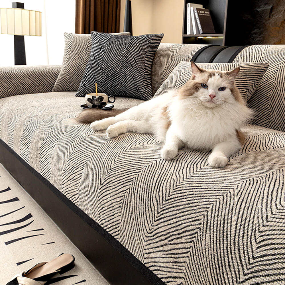 Chenille sofa cover with irregular tree pattern protecting a modern living room sofa.
