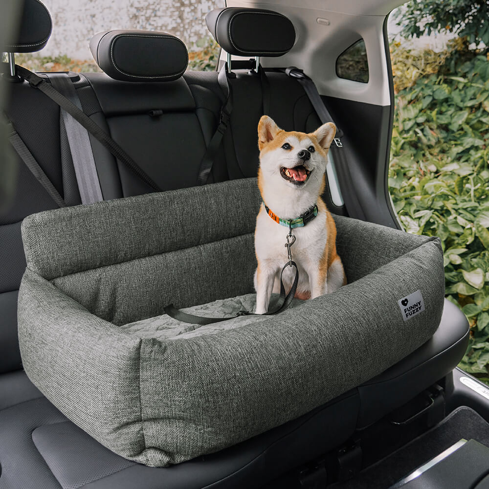 Dog comfortably resting in the Ultimate Travel Dog Car Bed while driving