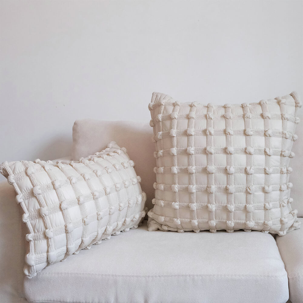 Elegant Checkered Lumbar Pillow on a luxurious sofa