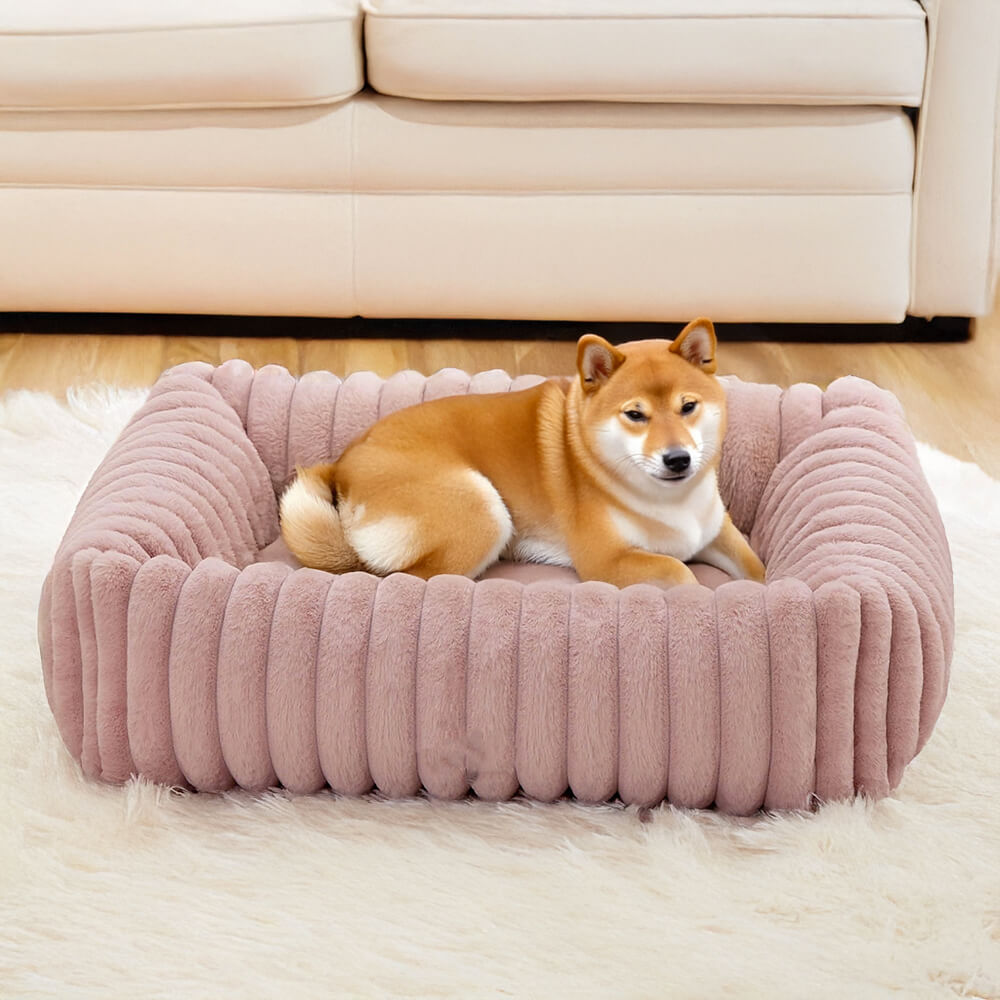 Close-up of bolstered sides on a cozy orthopedic dog bed, ideal for winter warmth