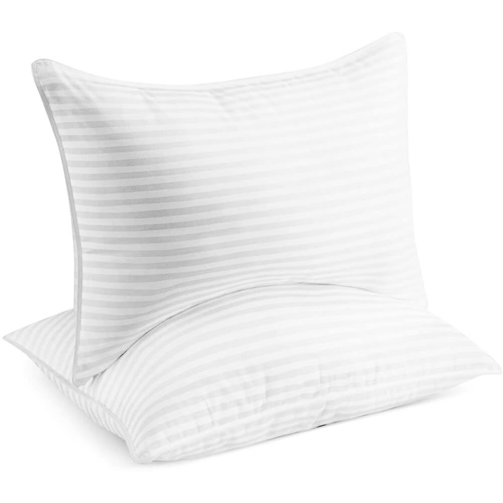A neatly stacked pair of DreamCloud queen size hotel pillows set on a crisp white bed, showcasing their plump shape and inviting texture.