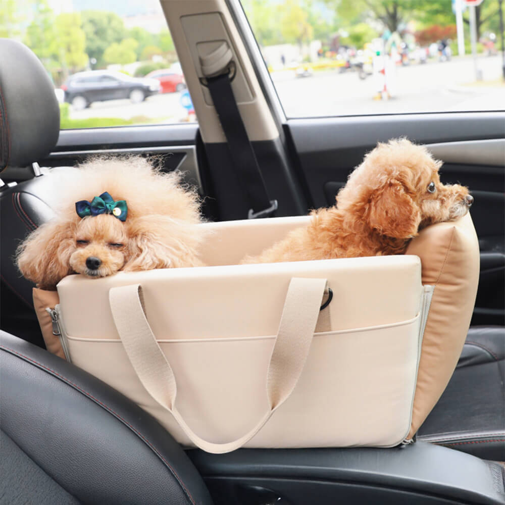 Waterproof pet carrier secured in a car console with safety buckle visible