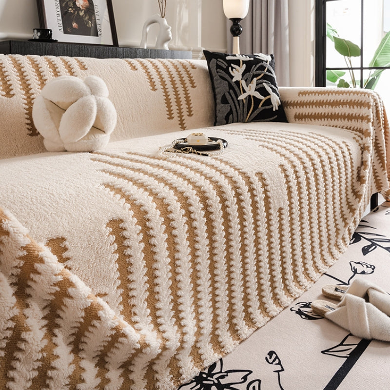 CozyPlush sofa protector draped elegantly over a sectional couch, highlighting its plush texture and protective features.